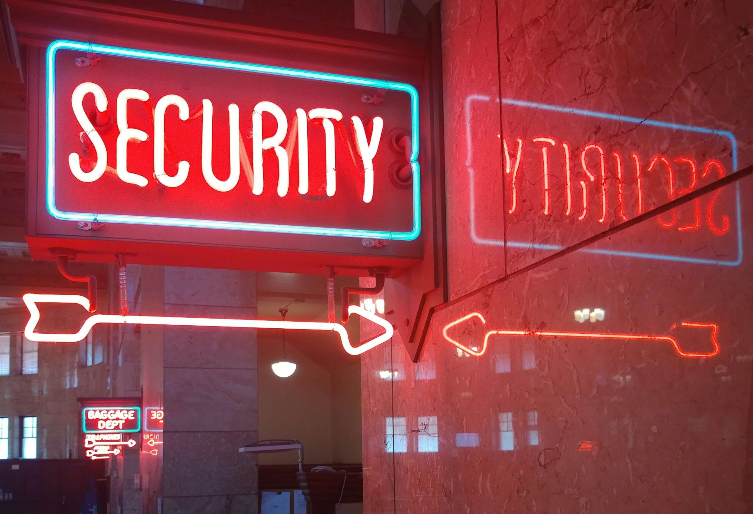 A red neon sign reading "Security" with a blue neon border to depict internet privacy policies. A red neon sign reading "Security" with a blue neon border to depict internet privacy policies.