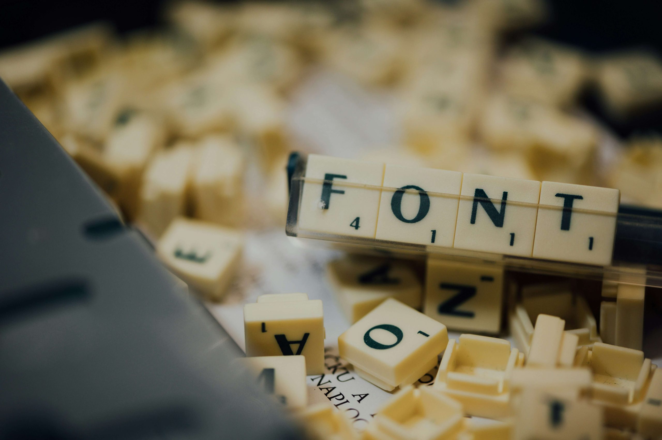 Scrabble tiles spelling the word "Font" to signify the new Helvetica font update. Scrabble tiles spelling the word "Font" to signify the new Helvetica font update.