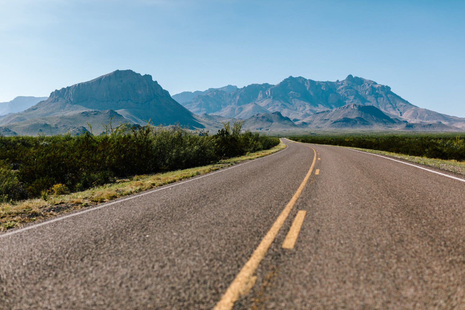 A long cement road surrounded by mountains to support our reflections on the content agency, past, present, and beyond. A long cement road surrounded by mountains to support our reflections on the content agency, past, present, and beyond.