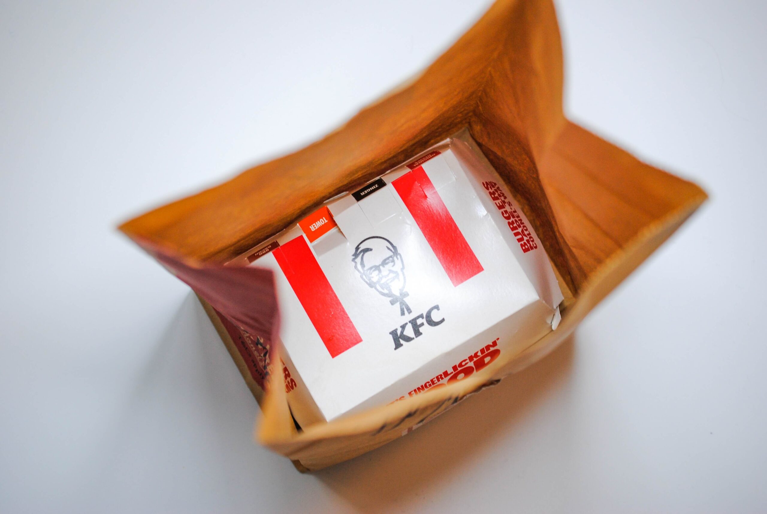 A bird's eye view of the KFC packaging with the tagline (it's finger lickin' good) partly visible.